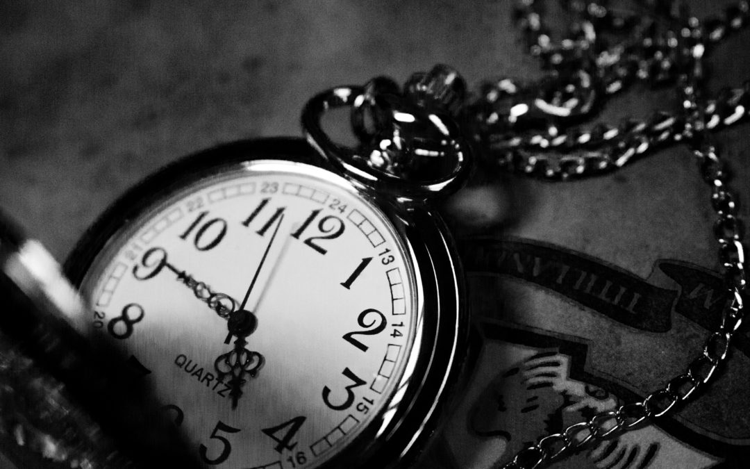 black and white photo of a pocket watch