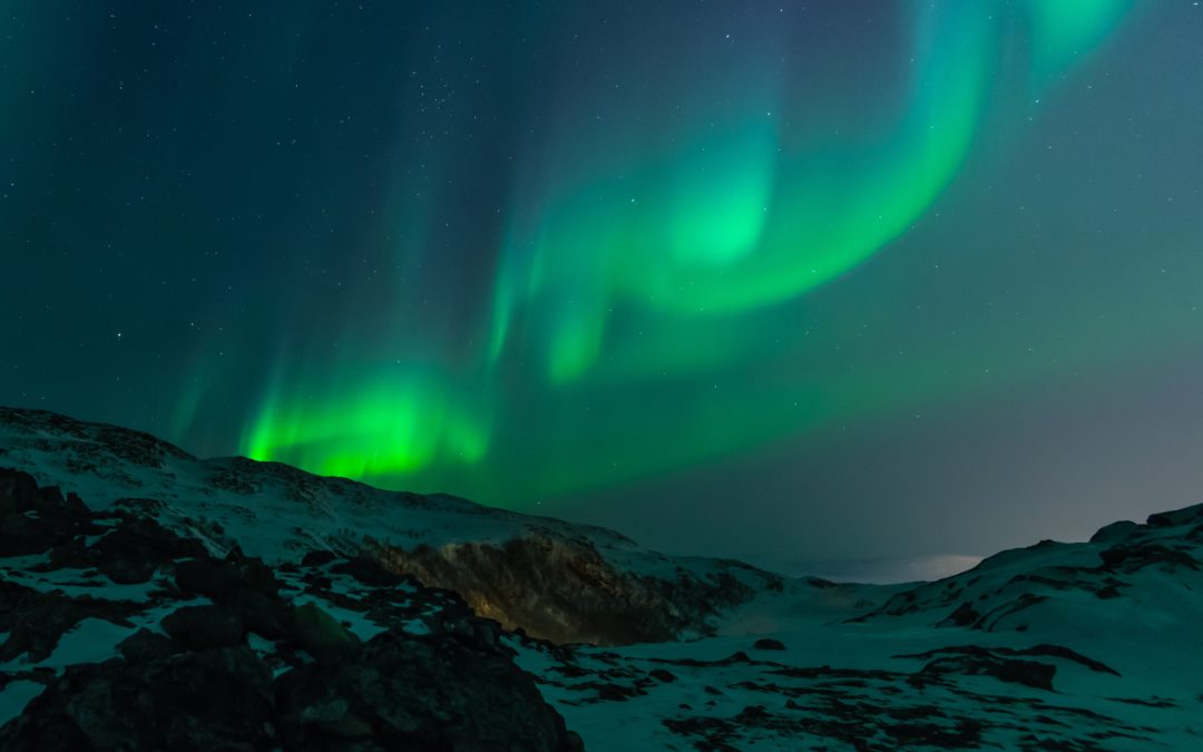 Aurora Borealis over mountains