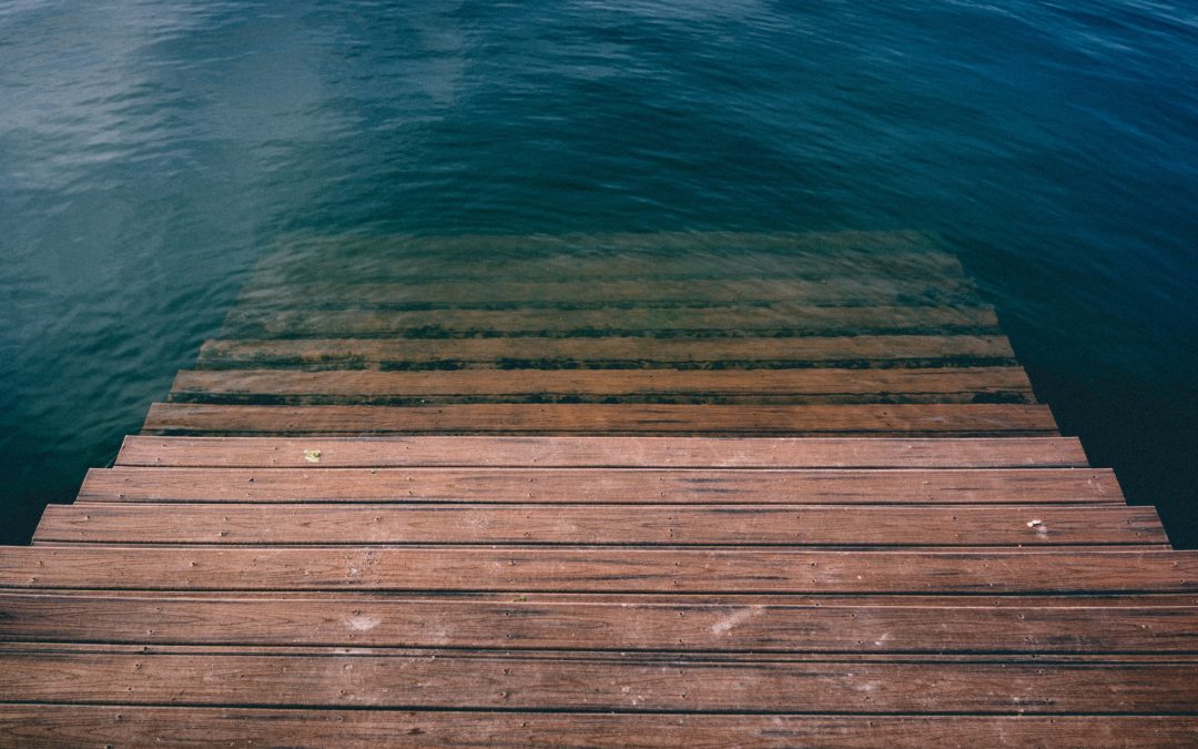 wooden stairs descending into water