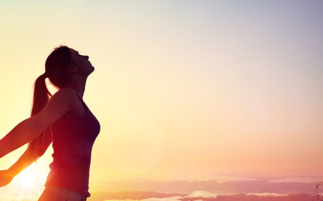 woman feeling free representing connecting to her higher self