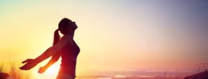woman feeling free representing connecting to her higher self