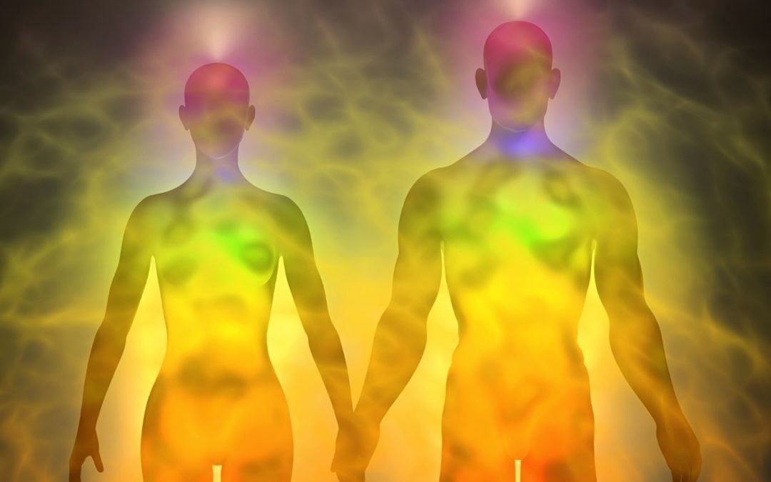 man and woman with chakras and energy around them representing your original energetic blueprint