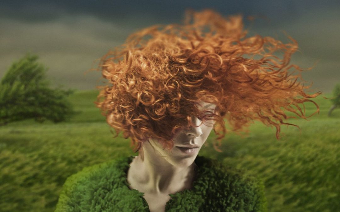 red haired woman being wind blown in an impending storm symbolizing emotion
