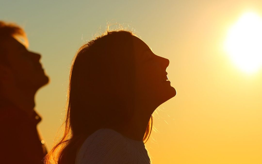 man and woman with chins tilted up representing the breath